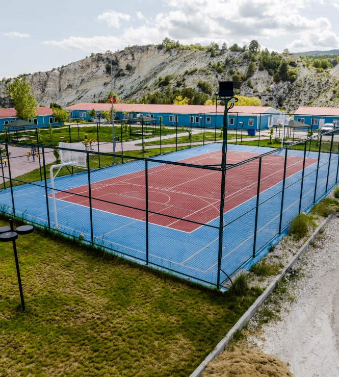 Tennis court school buildings hills